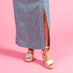 Load image into Gallery viewer, A knee length slit in the Ava Dress allows for comfort and cooling during hot summer days. The natural linen and rayon blend cools while maintaining coverage
