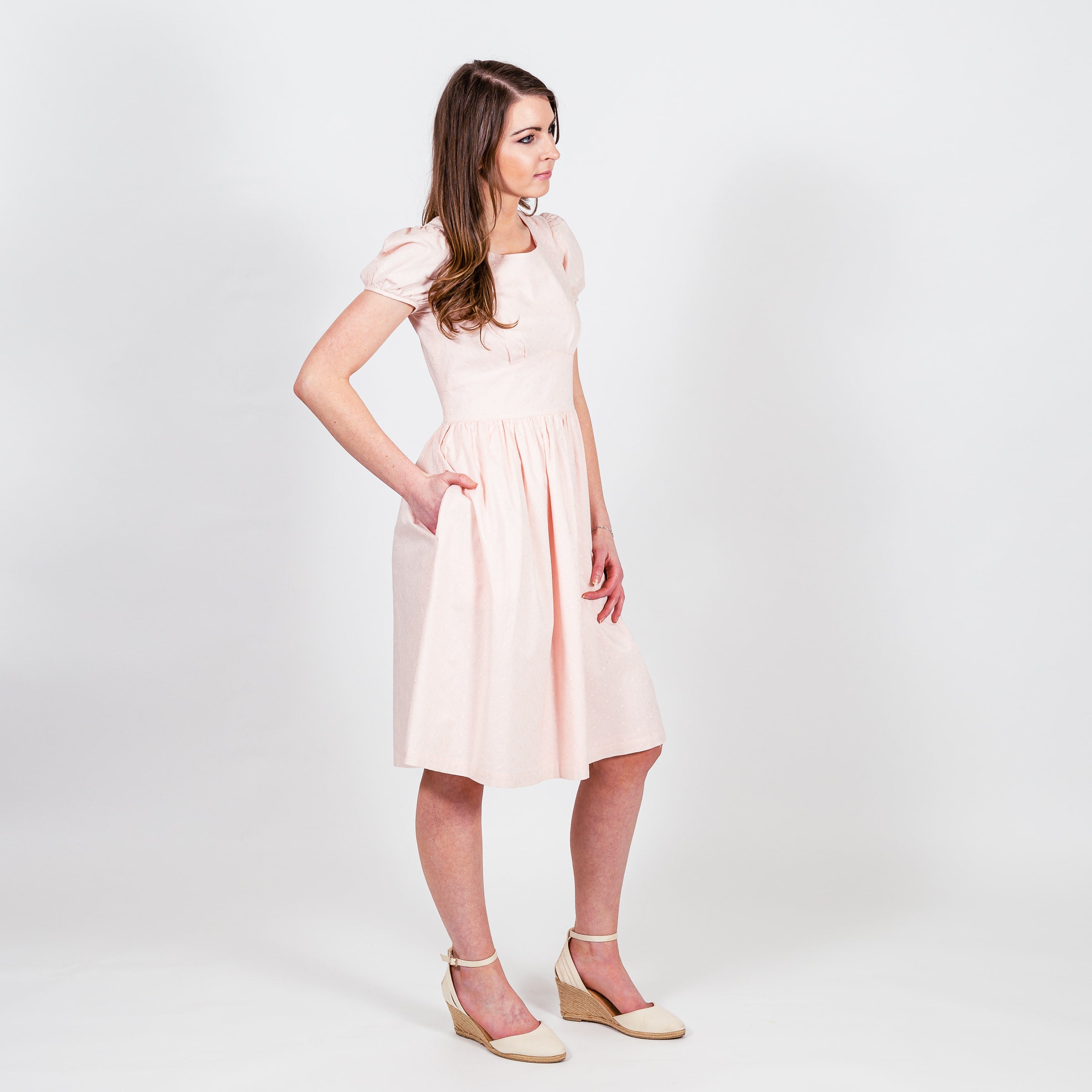 The Brigette Dress is an adorable modest fit and flair featuring a flattering waistline and hidden pockets