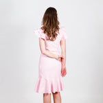 Load image into Gallery viewer, The ruffled hem adds a subtle but delightful detail to the Paulette Dress
